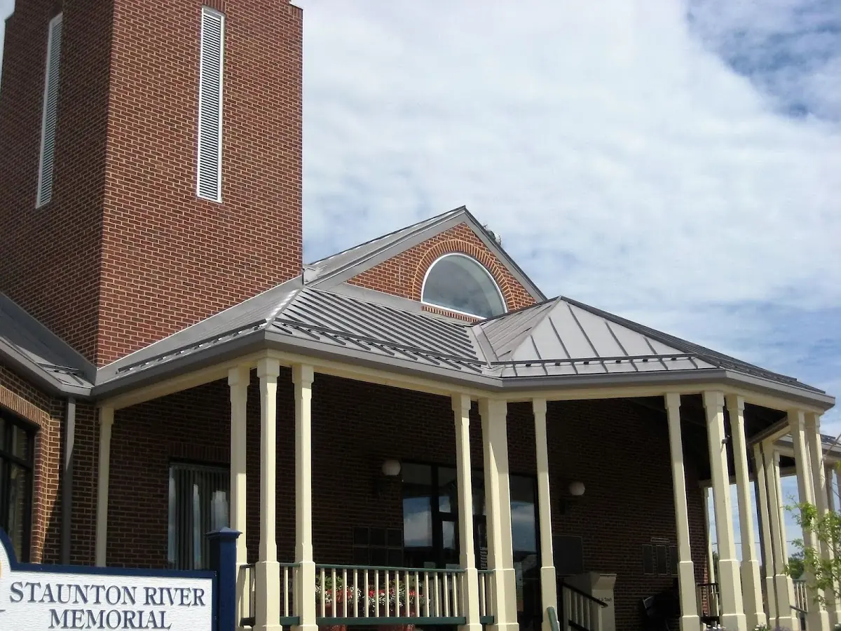 Skilled roofing craftsmen working on a residential roof in Beverly